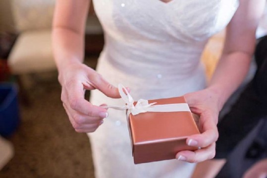 Bride opening her wedding gift